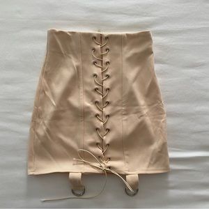 Tan mini skirt with silver hardware